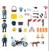 A collection of police-themed toy accessories and figures. Produktbild-Vorschau