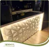 A modern kitchen counter with a 3D wall panel and integrated lighting. Podgląd zdjęcia produktu