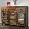 A rustic, multi-colored wooden sideboard with three drawers and three cabinet doors, displayed against a textured gray wall. Náhled obrázku produktu