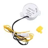 A small electric motor with wires and a yellow cap, isolated on a white background. Náhľad obrázku produktu