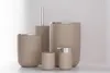 A set of bathroom accessories including a soap dispenser, toothbrush holder, cup, and trash can, arranged on a white surface. Produktbild-Vorschau