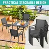 A patio set with chairs and a table on a wooden deck, with a stack of chairs in the foreground. Produktbild-Vorschau