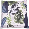 A close-up view of a pillow with a tropical leaf pattern. Produktbild-Vorschau