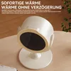 A white portable heater is placed on a wooden table, with text overlays describing its features. Produktbild-Vorschau