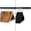 Two types of clothes hangers are displayed on a rod, separated by a dashed line. Produktbild-Vorschau