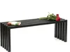 A black metal bench with a book and roses on it, set against a white background. Produktbild-Vorschau