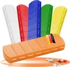 A set of colorful pill organizers arranged diagonally with an orange one in the foreground. Anteprima dell’immagine prodotto