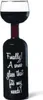 A wine bottle with a wine glass on top, filled with red wine. Náhľad obrázku produktu