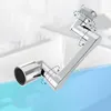 A chrome-plated faucet extender with a flexible, articulated arm, shown against a blurred white and light blue background. Náhled obrázku produktu