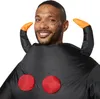 A close-up shot of a man wearing a black tarantula costume with red spots and orange-tipped appendages. Produktbild-Vorschau