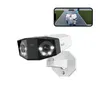 A security camera is shown mounted on a wall, with a smartphone displaying a live feed of the camera's view. Produktbild-Vorschau