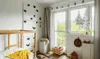 A child's bedroom with a climbing wall, bed, and window. Anteprima dell’immagine prodotto
