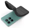A teal smartphone with a black protective case being placed on it. Náhled obrázku produktu