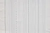 A collection of different stitch patterns created by a sewing machine on white fabric. Produktbild-Vorschau