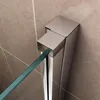 A close-up view of a shower door hinge and glass panel against a tiled wall. Produktbild-Vorschau