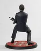 A statue of a man holding a rifle, standing on a circular base. Podgląd zdjęcia produktu