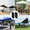A collage of four images showing different outdoor settings with tents, canopies, and umbrellas, all utilizing black weight bags for stability. Produktbild-Vorschau