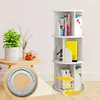 A white rotating bookshelf with books and decorative items on a light-colored floor, with a small table and plant to the left. An inset shows a rotating mechanism. Produktbild-Vorschau