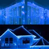 A collage of two images showing blue LED icicle lights decorating a window and a house. Produktbild-Vorschau