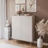 A modern living room setting with a white cabinet, decorative items, and artwork on the wall. Produktbild-Vorschau