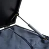 Close-up view of the interior of a black storage box, showing a gas strut mechanism and dark gray fabric lining. Produktbild-Vorschau