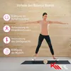 A woman is using a balance board indoors, with text overlays describing the benefits of balance boards. Produktbild-Vorschau