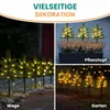 Collage of images showing mini Christmas trees with warm white LED lights used for decoration in different settings: a path at night, a planter, and a garden at night. Produktbild-Vorschau