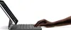 A hand is shown typing on a keyboard attached to a tablet. Anteprima dell’immagine prodotto