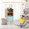 A child is sitting on the floor in a nursery or playroom next to a wooden bookshelf with a blue drawer featuring a bear face. A crib and a chest of drawers are also visible in the background. Anteprima dell’immagine prodotto