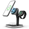 A black wireless charging stand holding a smartphone, smartwatch, and earbuds, with a white LED light strip around the base. Podgląd zdjęcia produktu