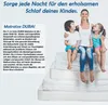 A mother and her two children are sitting on a stack of mattresses. Náhled obrázku produktu