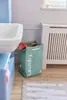 A bathroom scene with a sink, laundry basket, and radiator. Náhled obrázku produktu