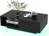 A black coffee table with a modern design, featuring a vase with greenery, books, and a bowl of berries. Anteprima dell’immagine prodotto