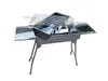A disassembled portable charcoal grill with multiple racks and trays, set against a white background. Produktbild-Vorschau