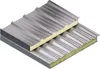 Two insulated metal panels, one stacked on top of the other, showing their corrugated structure and internal insulation. Voir les images du produit