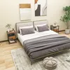 A bedroom scene with a bed, nightstands, and artwork. Produktbild-Vorschau