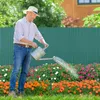 A man watering flowers in a garden. Produktbild-Vorschau