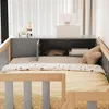 A child's bed with a built-in cabinet and shelves. Voir les images du produit