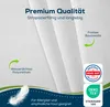 Close-up of white fabric with text overlays and certifications. Produktbild-Vorschau