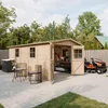 A wooden garden shed with its doors open, a lawnmower parked next to it, and outdoor furniture in the foreground. Voir les images du produit