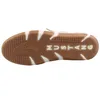 The sole of a beige and white sneaker is shown against a white background. Náhled obrázku produktu