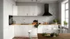 A modern kitchen with white cabinets, a black range hood, and a wooden countertop. Produktbild-Vorschau