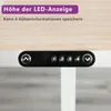 Close-up view of an adjustable standing desk control panel mounted under a desk. Voir les images du produit