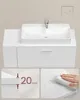 A bathroom vanity with a sink and faucet, featuring close-up details of the material thickness and water resistance. Náhled obrázku produktu