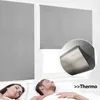 A couple sleeping in bed with gray blackout roller blinds covering the windows. Anteprima dell’immagine prodotto