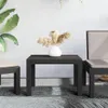 Outdoor furniture set with a table and chairs on a rug in front of a textured wall. Produktbild-Vorschau