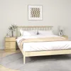 A bedroom scene with a bed, nightstand, and artwork. Produktbild-Vorschau