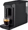 A black Tchibo coffee machine with a glass of espresso in front of it. Produktbild-Vorschau
