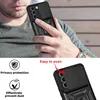 A person holding a phone case with a camera cover and a ring stand. Produktbild-Vorschau