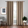 A pair of brown curtains hanging on a curtain rod in front of a window. A chair and a plant are also visible in the room. Voir les images du produit